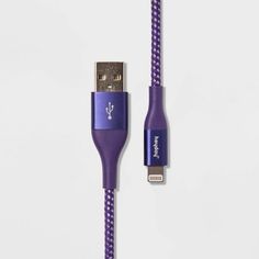 the purple braided usb cable is plugged into an iphone