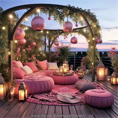 an outdoor seating area with lights and lanterns