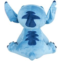 a blue stuffed animal sitting on top of a white floor