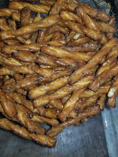 there is a pile of fried food in the pan on the stove top, ready to be eaten