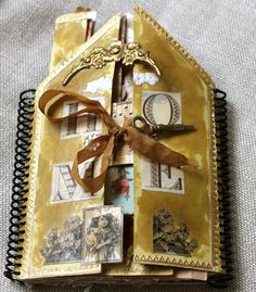 an open book with pictures and ribbons on it