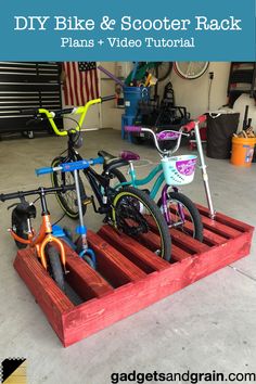 two bikes are parked in a wooden crate with the words diy bike and scooter rack plans + video