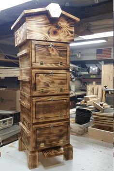 a tall wooden dresser sitting inside of a garage