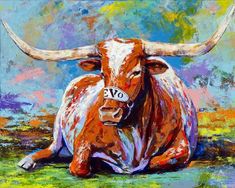 a painting of a cow with horns laying on the ground