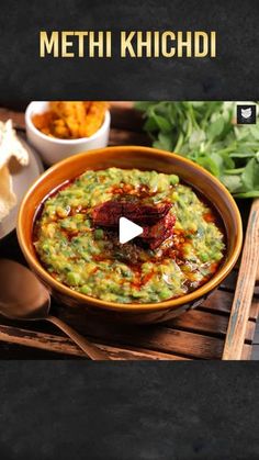 a bowl of guacamole and chips on a table with the words methi khichadi