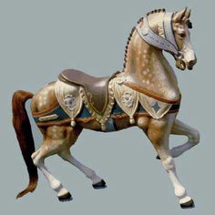 a statue of a horse with armor on it's back legs and head, standing in front of a gray background