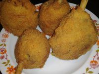 four fried food items are on a plate