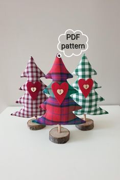 three wooden christmas trees with hearts on them and the words pdf pattern above them