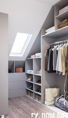 the closet is organized with clothes and shoes