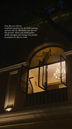 an open window at night with a lit up chandelier in the background and a quote written below