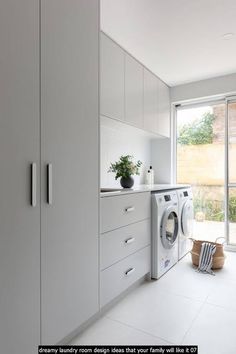 a washer and dryer in a white laundry room with sliding glass doors to the outside