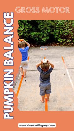 two young boys are playing with a ball