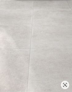 a skateboarder doing a trick in the air on a cement surface with his board