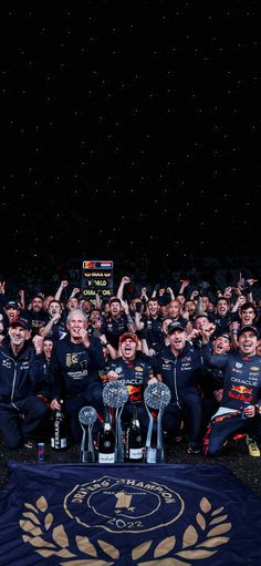 the red bull team celebrates with their trophy