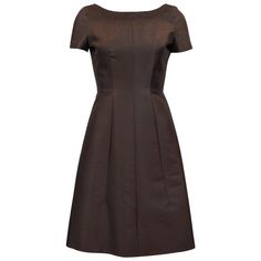 Stunning Prada cocktail dress from the early 1990s. This dress clearly is inspired by the clean and beautiful silhouettes from the 1950's. Chocolate brown silk taffeta with cascading tiny monochromatic beading that embellishes the neckline. Short sleeve and fit and flare shape, with a fitted bodice and a line skirt. The seam work creates such an elegant and flattering shape. Boat neckline in the front, with a lower scoop neckline in the back. Invisible brown zipper closure at centre back. Excell Brown Cocktail Dress, Brown Cocktail, Prada Dress, Belle Silhouette, Silk Taffeta, Couture Vintage, Brown Silk, Boat Neckline, Black Cocktail Dress