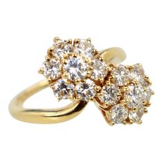 This is part of Chairish’s Fine Jewelry assortment.  Van Cleef & Arpels Fleurette Ring Double Flower Motif 18 Karat  This gorgeous Van Cleef & Arpels Fleurette Double Flower Ring from the Van Cleef Fleurette collection is now discontinued. The ring is set in 18 Karat gold with 1.70 Carats of E,F and VVS1 brilliant round cut diamonds coming together in two floral motifs. Also, the head of the ring measures 17.5mm x 14mm and the band measures 1mm wide. Signed and numbered, the ring size is 48 or 4 Van Cleef Engagement Ring, Van Cleef Between The Finger Ring, Van Cleef Signature Ring, Van Cleef Arpels Butterfly, Perlee Ring Van Cleef Arpels, Van Cleef And Arpels Jewelry Butterfly, Van Cleef, Van Cleef Arpels, Flower Ring