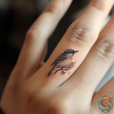 a small bird tattoo on the ring finger is an easy way to get inked