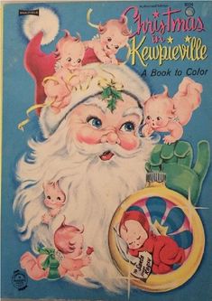 an old fashioned christmas book with santa claus and babys on it's back