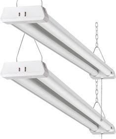 two white fluorescent lights hanging from chains