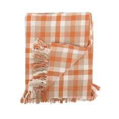 an orange and white checkered blanket with fringes