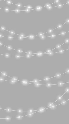 a string of white lights on a gray background