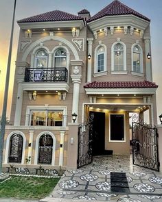 a large house with many windows and balconies