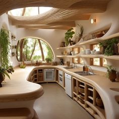 a kitchen filled with lots of counter top space next to a sink and stovetop oven