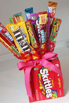 a candy box filled with lots of different types of candies and chocolate bar wrappers