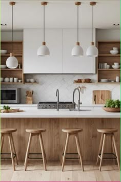 three stools in front of a kitchen island with white countertops and wooden cabinets