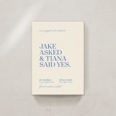 a white and blue wedding card with the words, jake asked & tiana said yes