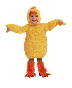 a child in a chicken costume standing on one leg and arms spread out to the side