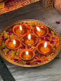 small candles are placed in the middle of a plate