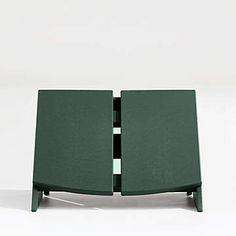 a small green table with two sections cut out to look like an open bookcase