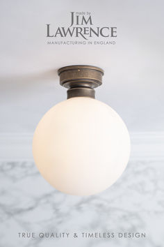 a white light fixture hanging from the ceiling