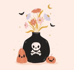 a vase filled with flowers and two jack - o'- lanterns