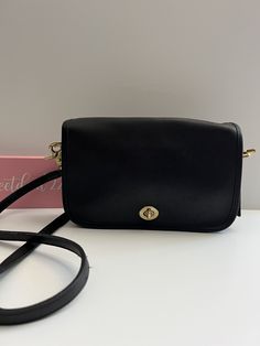 "Vtg Coach Original  Pocket Purse Black leather with brass hardware Roomy interior with one inner slip pocket and one outer slip pocket covered by a flap and secured with a turnlock Outer back pocket Removable 39\" strap  When strap is removed it can be worn as a clutch or replaced with other straps  Hang tag and chain Measures: 9.5\"L, 6\"H, 2\"W Made in the United States #419-9394 Cleaned, conditioned and ready to wear! Questions? Just ask More vintage coach styles/colors are also available b2 Classic Flap Bag With Cc Turnlock Closure, Classic Double Flap Shoulder Bag With Cc Turnlock Closure, Classic Shoulder Bag With Cc Turnlock And Double Flap, Classic Travel Bag With Cc Turnlock Closure, Classic Leather Bag With Cc Turnlock Closure, Classic Business Flap Bag With Cc Turnlock Closure, Classic Double Flap Business Bag, Classic Formal Flap Bag, Classic Evening Satchel With Turn-lock Closure