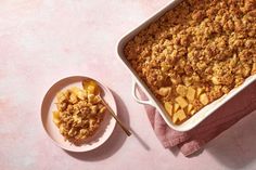 a casserole dish filled with cereal next to a bowl of oatmeal