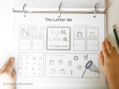 the letter n worksheet is being displayed on a white board with two hands