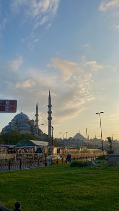 the sky is very blue and there are many buildings in the background