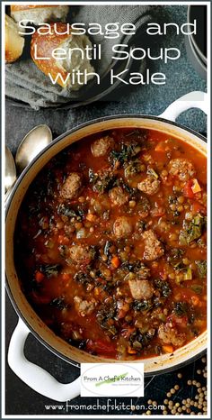 sausage and lentil soup with kale in a white pot on a black table