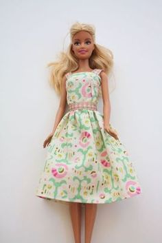 a barbie doll wearing a dress and shoes