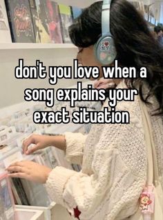 a woman wearing headphones and looking at cds in a store with the words, don't you love when a song explains your exact situation