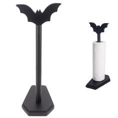 two black and white paper holders with bats on them, one holding a tissue dispenser