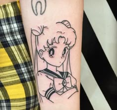 a woman's arm with a sailor tattoo on it