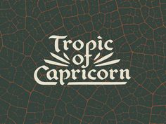 the words tropic of capricon on a black background with brown and white patterns