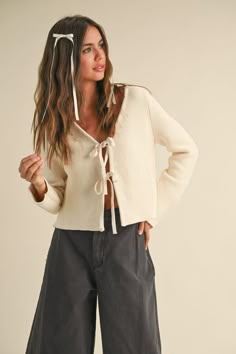 This knit cardigan is the epitome of classy cuteness. The tie front design adds a touch of simplicity to this premium knit piece. A perfect combination for a fun and fashionable look! Tie Front Cardigan Outfit, Tie Cardigan Outfit, Tied Cardigan, Tie Cardigan, Tie Sweater, Cardigan Outfit, Tie Front Cardigan, Cardigan Outfits, Fall Fits