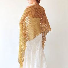 Gold Metallic Shawl Elevate your style with an elegant hand-crochet gold shawl at weddings or evening events. This sparkly wrap is perfect to complement any outfit. Moreover, this coverup is a wonderful gift. MATERİAL: 60% Metallic Polyester 40% Polyamide COLOR: Gold colored as shown AVAİLABLE COLORS: Gold and Silver MEASUREMENTS: Length: 75'' (190cm) Width: 19'' (50cm) CARE INSTRUCTIONS: * Hand wash * Use a mild, non biological detergent * Use a cool iron avoiding prints * Do not tumble dry * L Elegant Lace Shawl Dupatta, Elegant Gold Dupatta, Elegant Gold Dupatta As Gift, Crochet Lace Shawl For Wedding, Wedding Crochet Lace Shawl, Elegant Crochet Shawl For Wedding, Wedding Lace Crochet Shawl, Elegant Lace Shawl Scarf, Gold Bohemian Shawl For Wedding