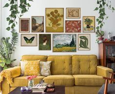 a living room filled with furniture and lots of pictures on the wall above it's couch