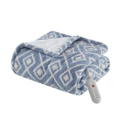 a blue and white blanket with a remote control