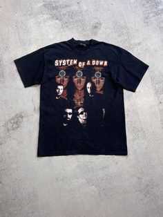 This vintage System of a Down T-shirt is a rare find for any fan of the band. The graphic print features the band's logo in bold black ink on a comfortable cotton material. With a crew neckline and short sleeves, this shirt is perfect for any season and occasion. The shirt is a size M and has a regular fit, making it a great addition to any wardrobe. Its 90s music theme is sure to turn heads and make a statement. Don't miss out on the chance to own this unique piece of band memorabilia. Size M (see measurements) From shoulder to shoulder - 50 cm From armpit to armpit - 51 cm The length of the back is 70 cm Condition 9/10🔥  See all photos and read description.   If you need any other information about postage, sizes, photos, etc., please contact me💌   I will be happy to help you🤝    Brow Grunge Short Sleeve T-shirt For Concert, Vintage Graphic Print T-shirt For Alternative Fashion, Vintage Black T-shirt With Graphic Design, Vintage Short Sleeve T-shirt For Music Festivals, Band Merch T-shirt With Logo For Music Festivals, Band Merch T-shirt For Music Festivals With Logo, Band Merch Cotton T-shirt With Band Logo, Alternative Band Logo Tops For Music Festivals, Band Merch T-shirt With Logo For Concert